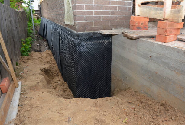 SJ Waterproofing Pros technician performing targeted Emergency Waterproofing assessment in Fairport, NY